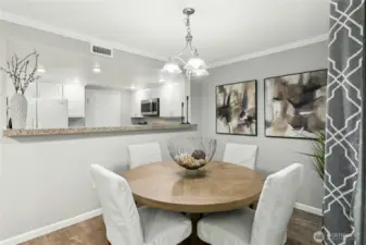 Open-concept living and dining area flows effortlessly into the kitchen and private patio — the perfect layout for modern living.
