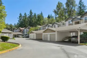 Sundance Community Parking & Setting - Two allocated uncovered parking spaces come with this one-bedroom unit. The attractive architecture is complemented by a lush, tree-lined backdrop for a serene Northwest setting.