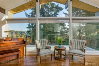 The formal living room greets you with floor-to-ceiling windows and a view of Mt Rainier