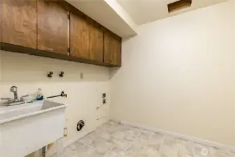 Laundry room includes utility sink plus laundry chute from upstairs hall bath. Garage has laundry hookups too!