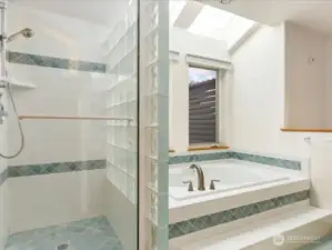 Primary bath with shower and soaking tub.