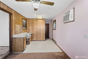 carport area converted to in home salon with half bath