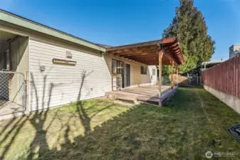 rear yard, accessed from carport and kitchen
