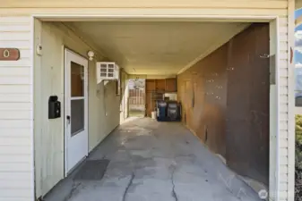 carport area with man door to salon conversion