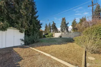 storage unit in side fenced yard with gate from Gilmore Street