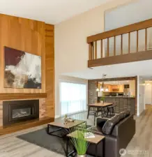 Great room with gas fireplace, virtually staged