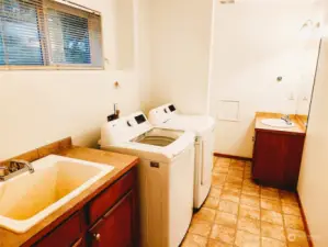 Utility room and half bathroom
