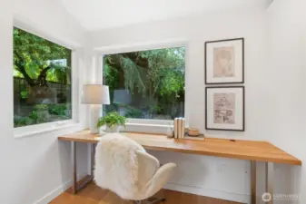 Lavish primary suite with french doors that open to deck, huge walk in closet with organizer, separate office niche an spa like bath. THIS IS THE PICTURE OF THE OFFICE NICHE OFF THE PRIMARY BEDROOM