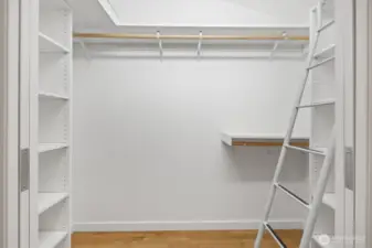 Lavish primary suite with french doors that open to deck, huge walk in closet with organizer, separate office niche an spa like bath. This is the walk in closet with built in organizer