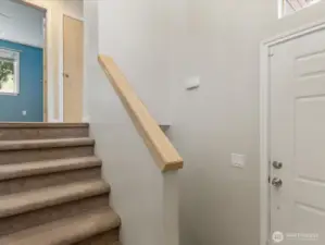 View from foyer/landing heading to lower level of home