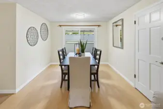 Spacious dining room with a slider that opens to the large covered deck.