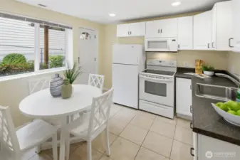 Beautiful kitchen in the basement apartment. Exterior access door to right of window.