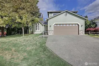 Two car garage with ample driveway parking.