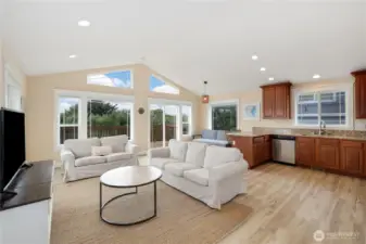 Vaulted ceilings and a wall of windows bring in natural light
