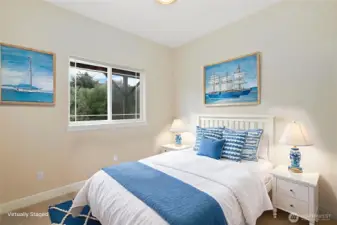 Downstairs bedroom with tall ceilings