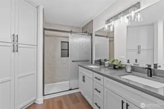 Primary En Suite Bath w/Custom Built-In Linen Cabinet, Extra Long Vanity w/Double Sinks and Custom Tiled Shower w/Glass Doors. Full Length Mirror, too!