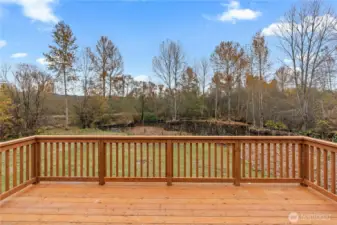 Entertainment size deck overlooking the backyard and wetlands area. Beyond the backyard is the Foothills trail and the Puyallup River.