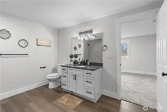 What is referred to as a "Jack and Jill" Bathroom is shared by both secondary bedrooms and has access from the Family Room, as well.