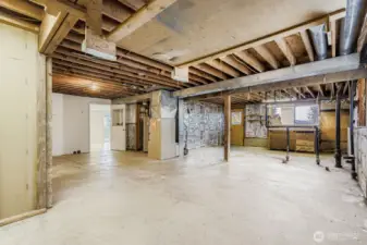 Massive unfinished area in lower level.  Plumbing is already for another bathroom.  Could add 2 or 3 more bedrooms.  Separate entrance leads to back yard.