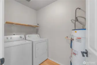 Laundry room with electric hot water heater