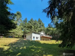 The home as seen from the wooded area below.