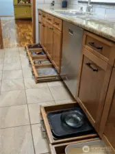 Custom solid wood cabinetry and extra "toe-kick" storage drawers!