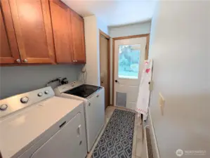 Pantry and laundry just off the kitchen! There is a back porch and a special door for fido! The property also has an invisible fence for your four legged friend.