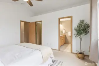 Primary room with view of walk-in closet and attached full bathroom.