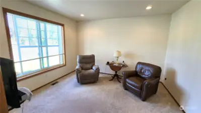 This room off the entry is set up for a 4th bed, office/den or media room.