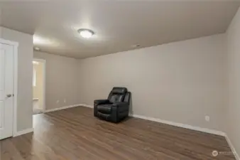 Another view of family room. Door to left opens to garage. Doorway on right leads to 3rd bedroom.