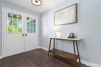 Double door entry with luxury vinyl plank flooring