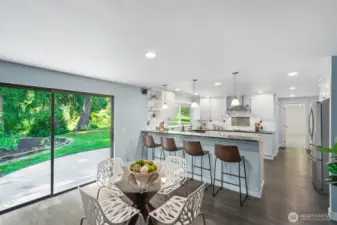 Casual dining area with sliding glass door to the beautiful back yard.