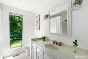 Full bathroom in hall.