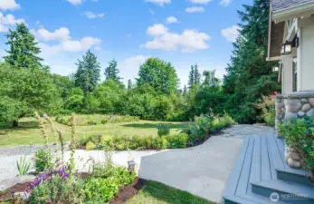 Front porch with with French doors to the Bonus room. Surrounded by beautiful new landscaping.