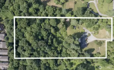 Over 5 spectacular acres! Property markers are estimated. Seller owns the lane to the property.