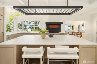 custom blackened steel lighting and hood.