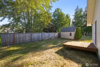 Outside, you'll love the expansive yard, tool shed, and dappled lighting.