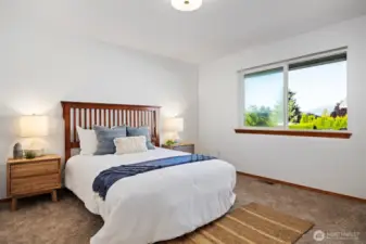 The primary bedroom is spacious and tucked back at the far end of the hallway.