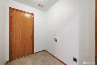 Laundry room with access to the garage and washer/dryer hook-ups.