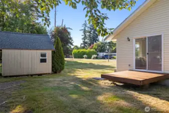 The back deck off the living room and tool shed.