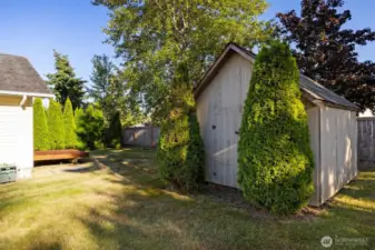 The storage shed is perfect for all your gardening needs, and the little deck off the house is primed and ready for your summer grilling!