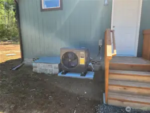 Back door to the utility room and HVAC unit in photo to help regulate the AC for the hot summers and heat for cozy winters.