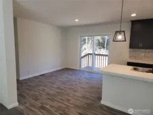The dining area has a wonderful view of the back of the property and lots of space for a good sized table.