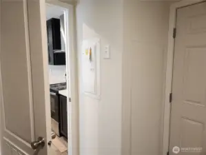 Utility room entrance from the kitchen.  Electrical panel easily accessible.