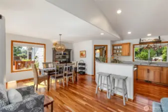 Open concept with eating bar and dining with lots of light.