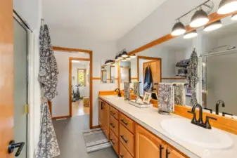 Galley style primary bathroom with addition of studio for fitness or office.