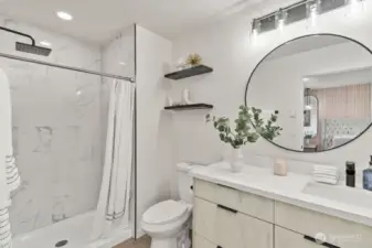 Primary bedroom includes a private en-suite bathroom for added convenience and privacy.