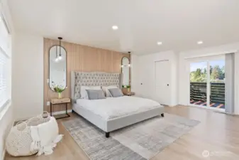 Second primary suite offers abundant natural light, a touch of luxury, and direct access to a private deck.