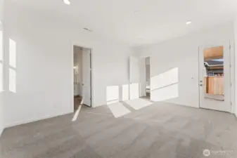 Actual Home   Primary Bedroom with door leading to covered patio