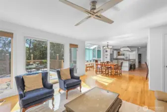 Looking back toward the kitchen and dining space, the open-concept layout comes to life. The family room, breakfast area, and kitchen work together as the true hub of the home, perfect for gatherings both large and small.